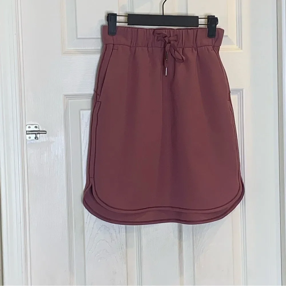 Lululemon on the fly skirt, color: cherry cola, size 4